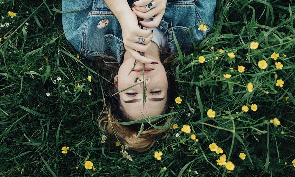 Girl lying in a field